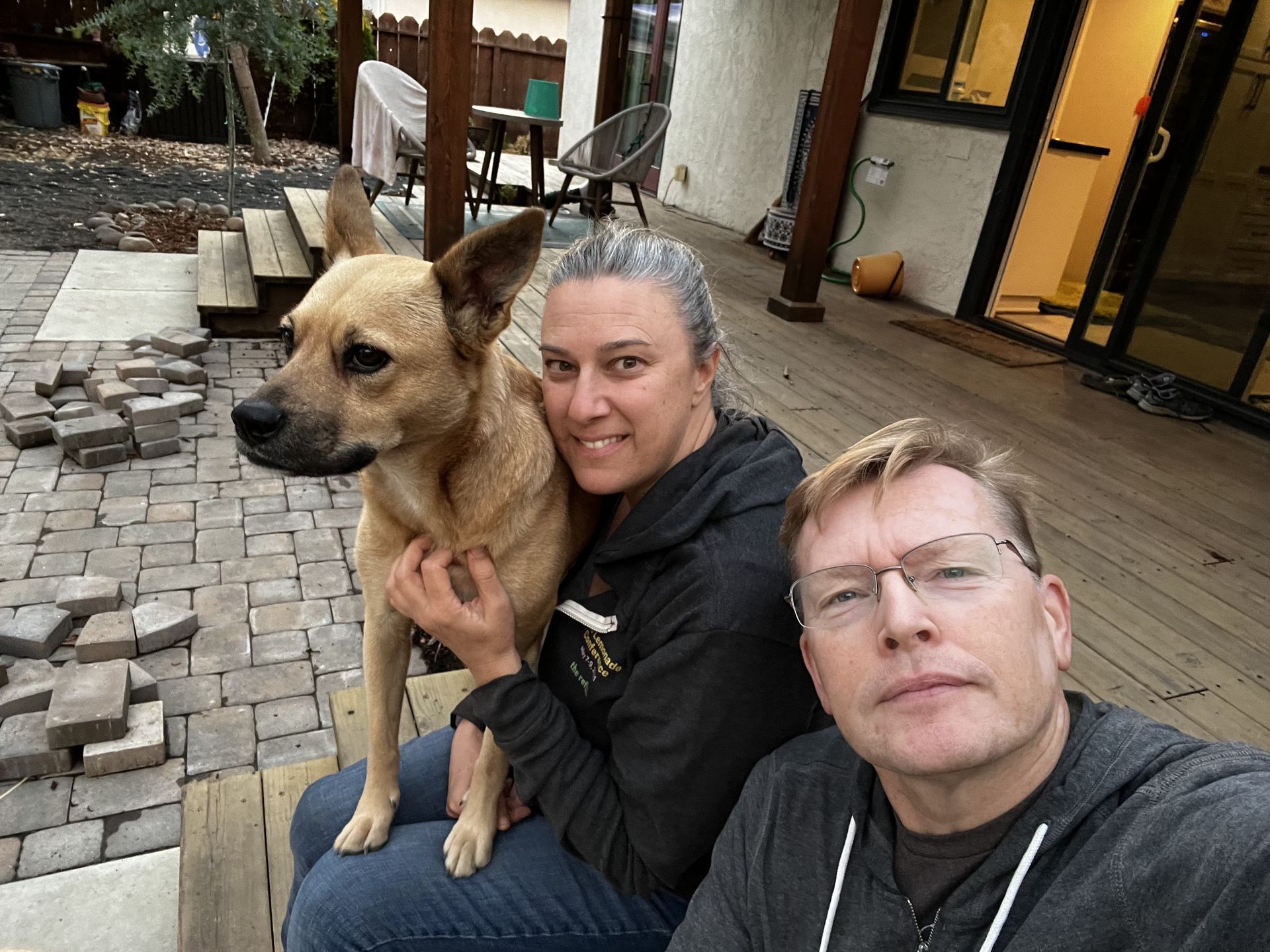 Posey with family on the back patio