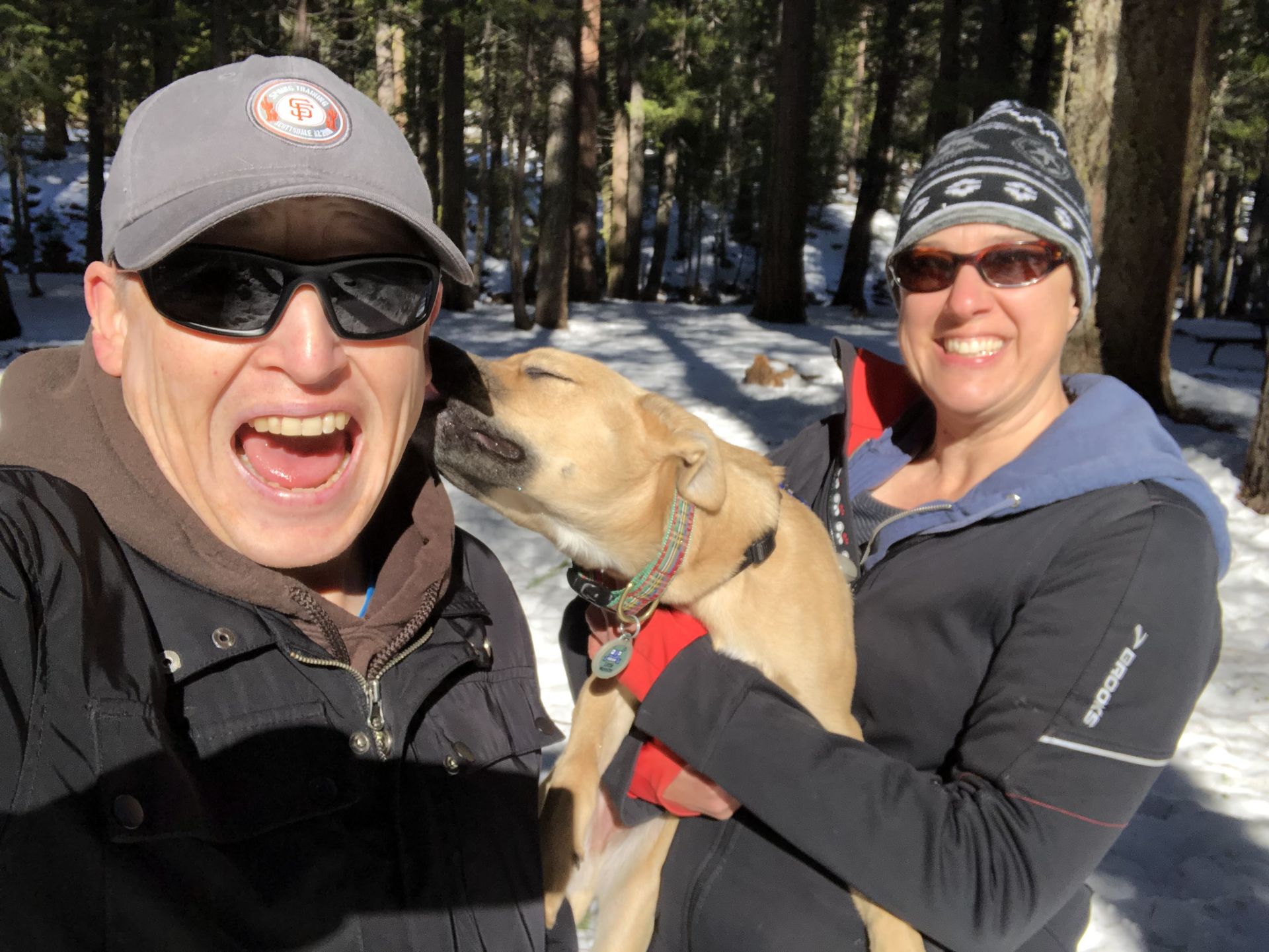 Posey with two people, bundled up for winter